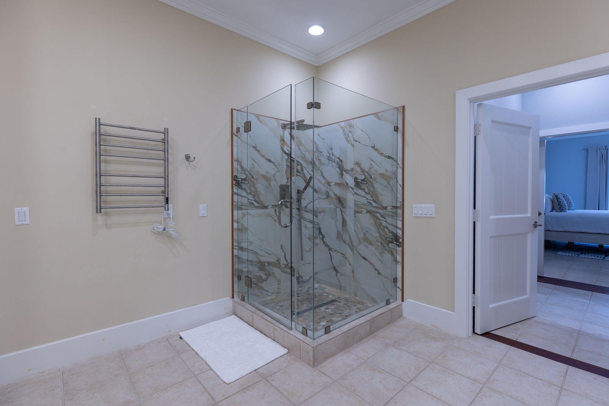 Glass-enclosed shower in the primary suite bath