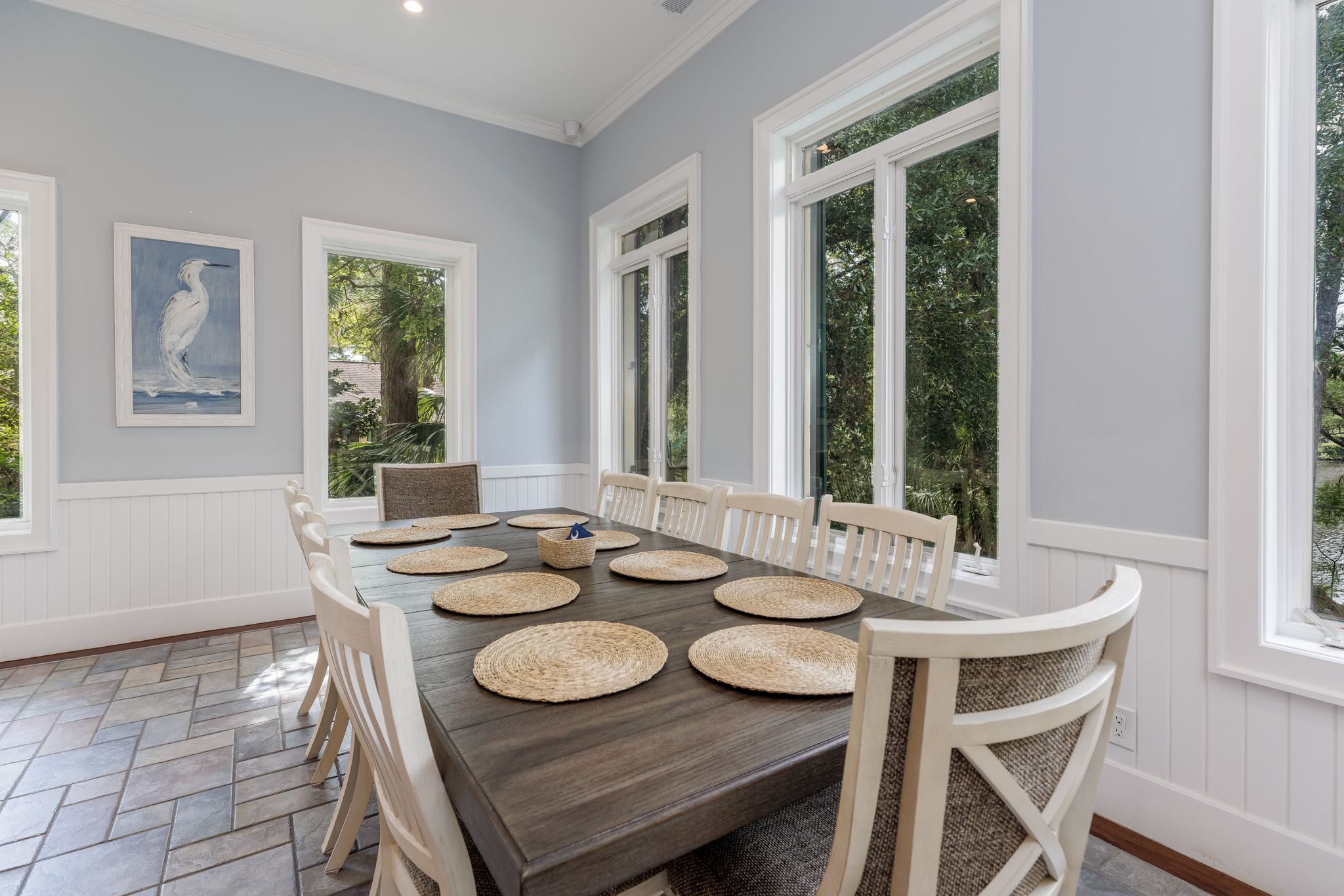 Oversized dining table set as a working boardroom in the shared center of the estate