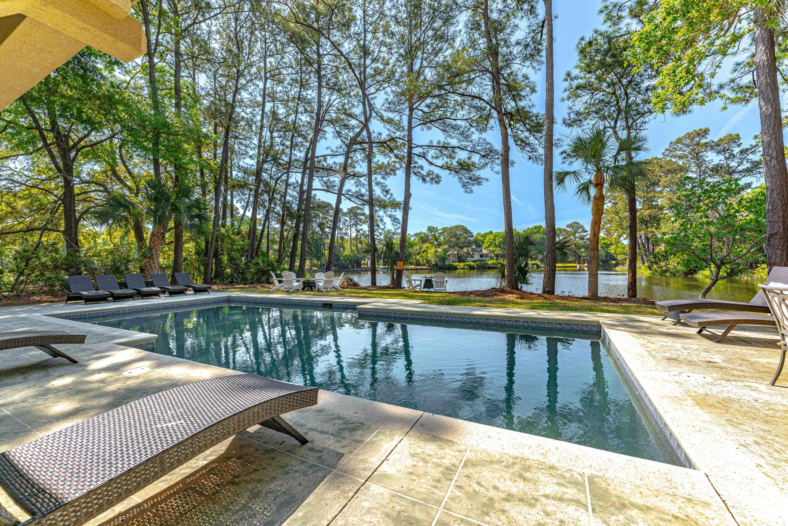 Poolside lounger looking out over the lagoon at the Palmetto Dunes estate for a quiet reset